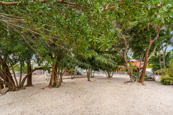 an aerial view of a house with garden space and sitting area