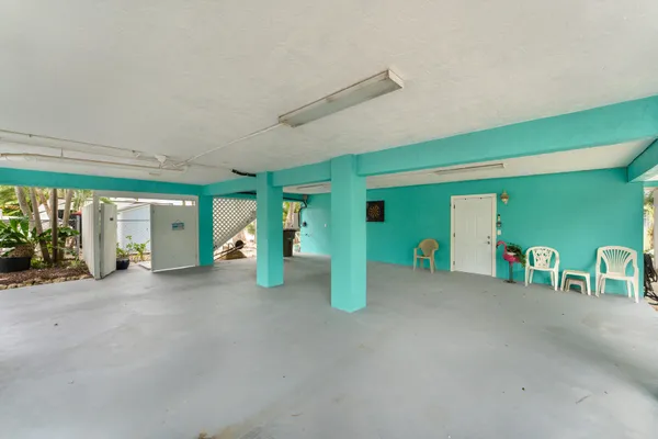 a large kitchen with lots of counter space a sink and appliances