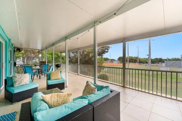 an aerial view of a house with garden space and lake view