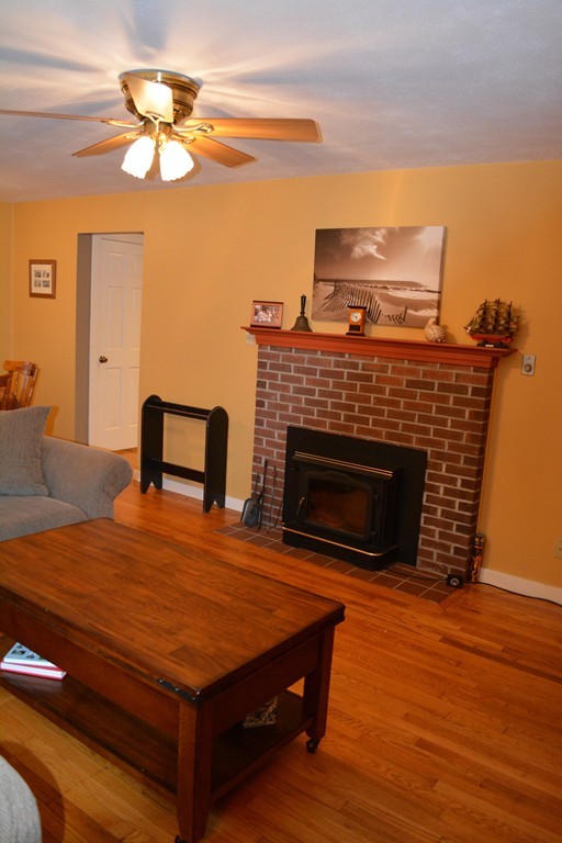 17 Crest Road Monson, MA 01057 - Photo 6 of 11 a living room with furniture a fireplace and a flat screen tv
