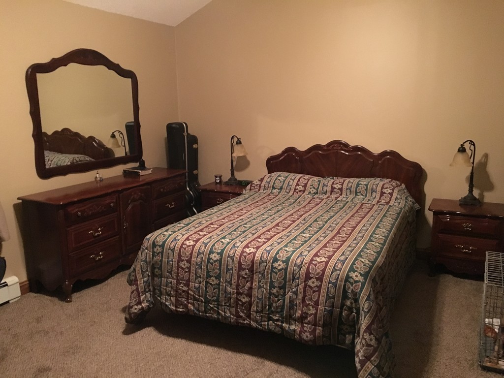 17 Crest Road Monson, MA 01057 - Photo 8 of 11 a bedroom with a bed and a dresser with mirror