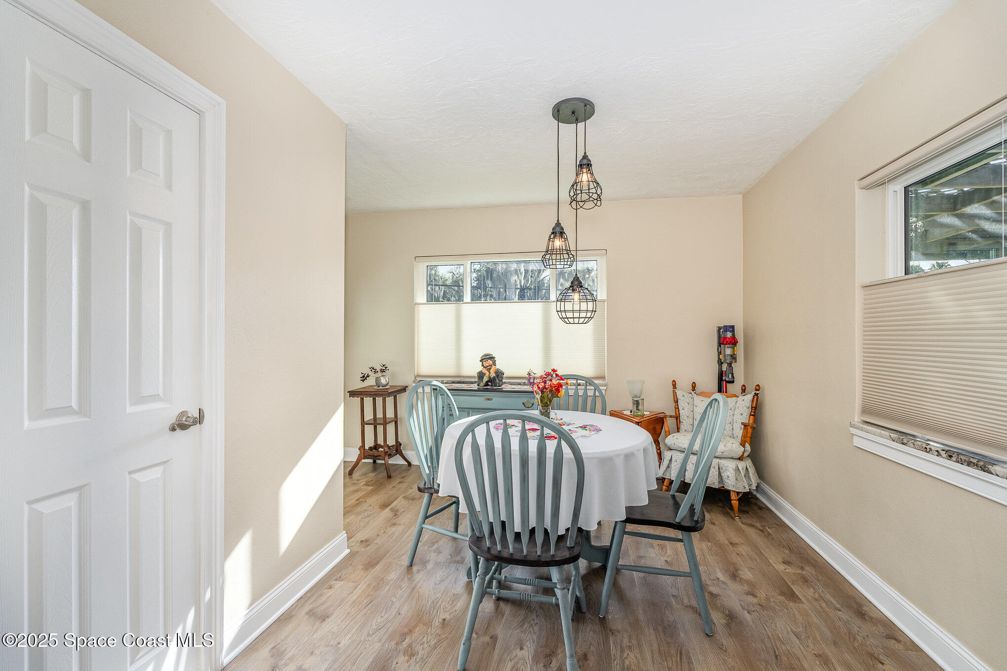 701 Espanola Way Melbourne, FL 32901 - Photo 11 of 29 a view of a dining room with furniture window and outside view