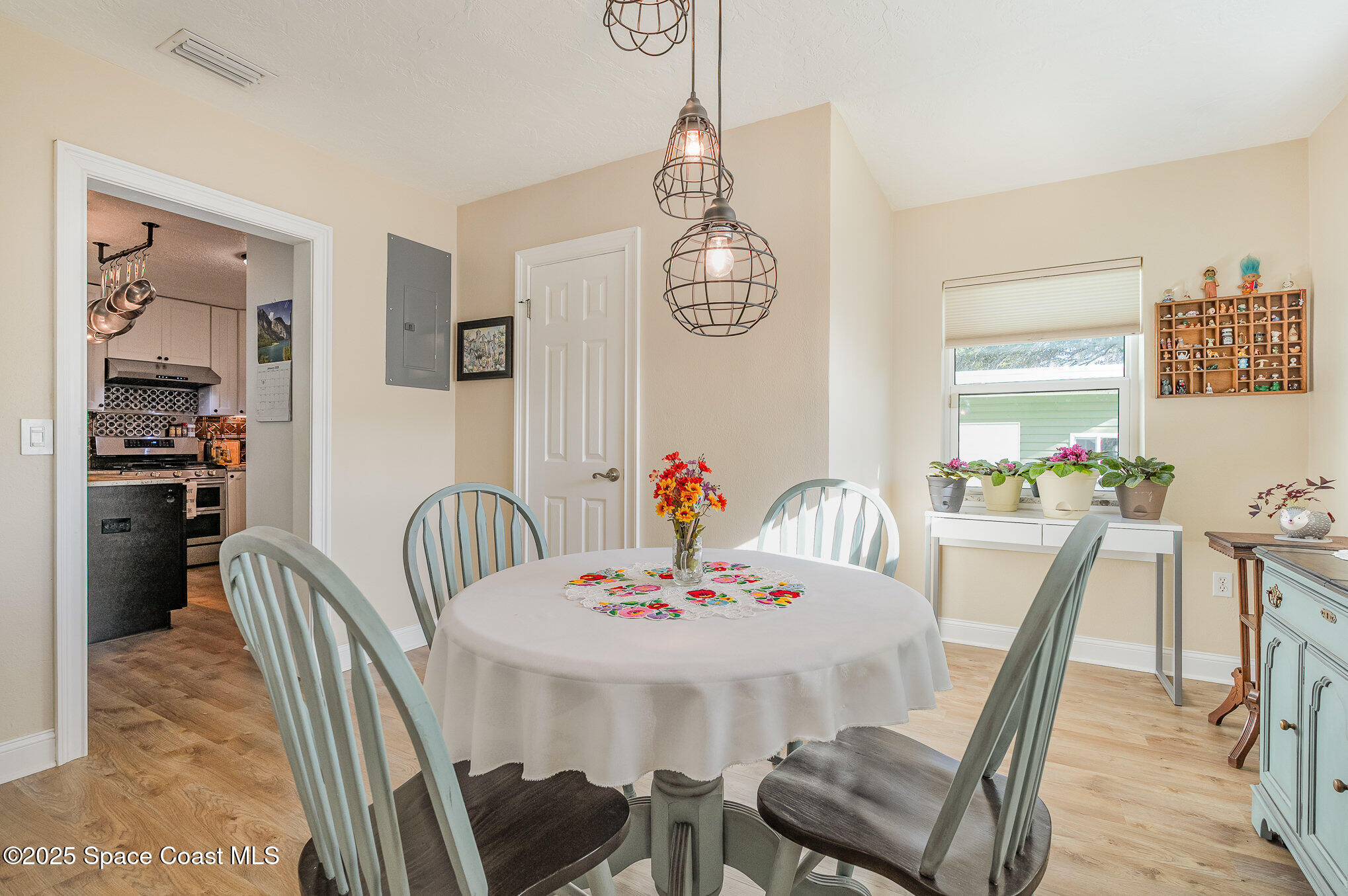 701 Espanola Way Melbourne, FL 32901 - Photo 12 of 29 a view of a dining room with furniture and a chandelier