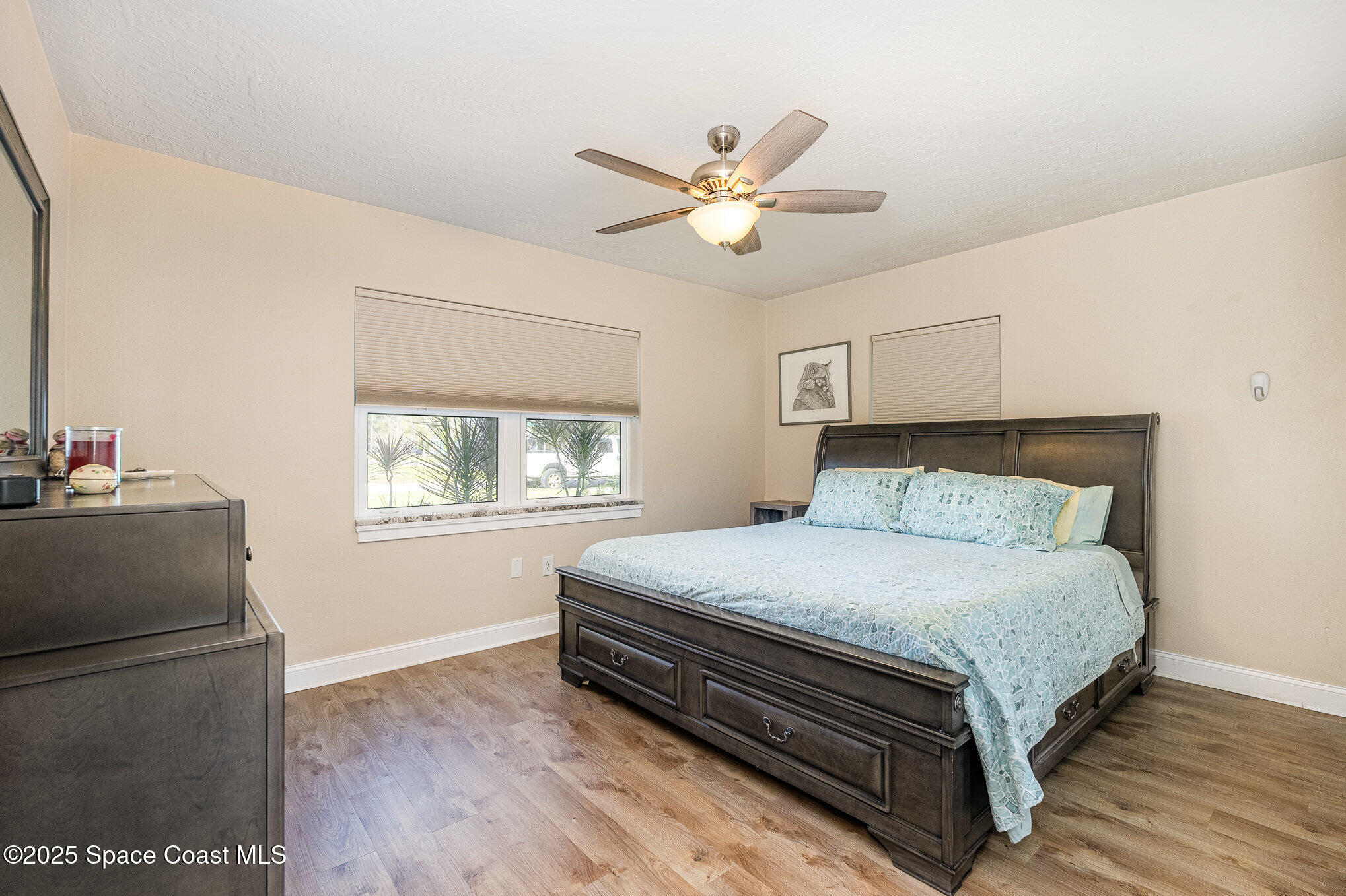 701 Espanola Way Melbourne, FL 32901 - Photo 13 of 29 a bedroom with a bed and a window