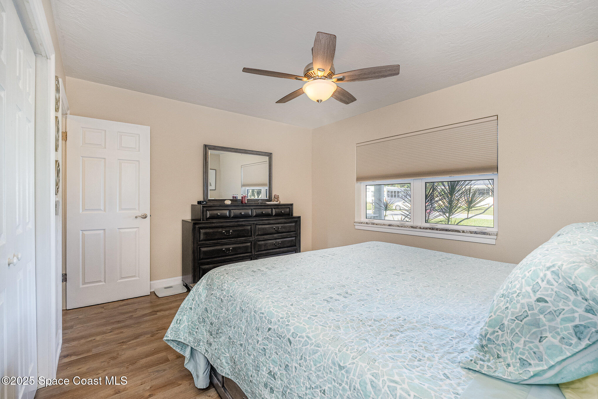 701 Espanola Way Melbourne, FL 32901 - Photo 16 of 29 a bedroom with a bed and a window
