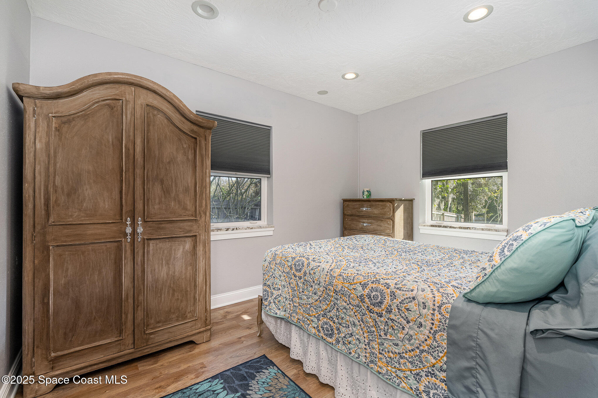 701 Espanola Way Melbourne, FL 32901 - Photo 18 of 29 a bedroom with a bed and a window