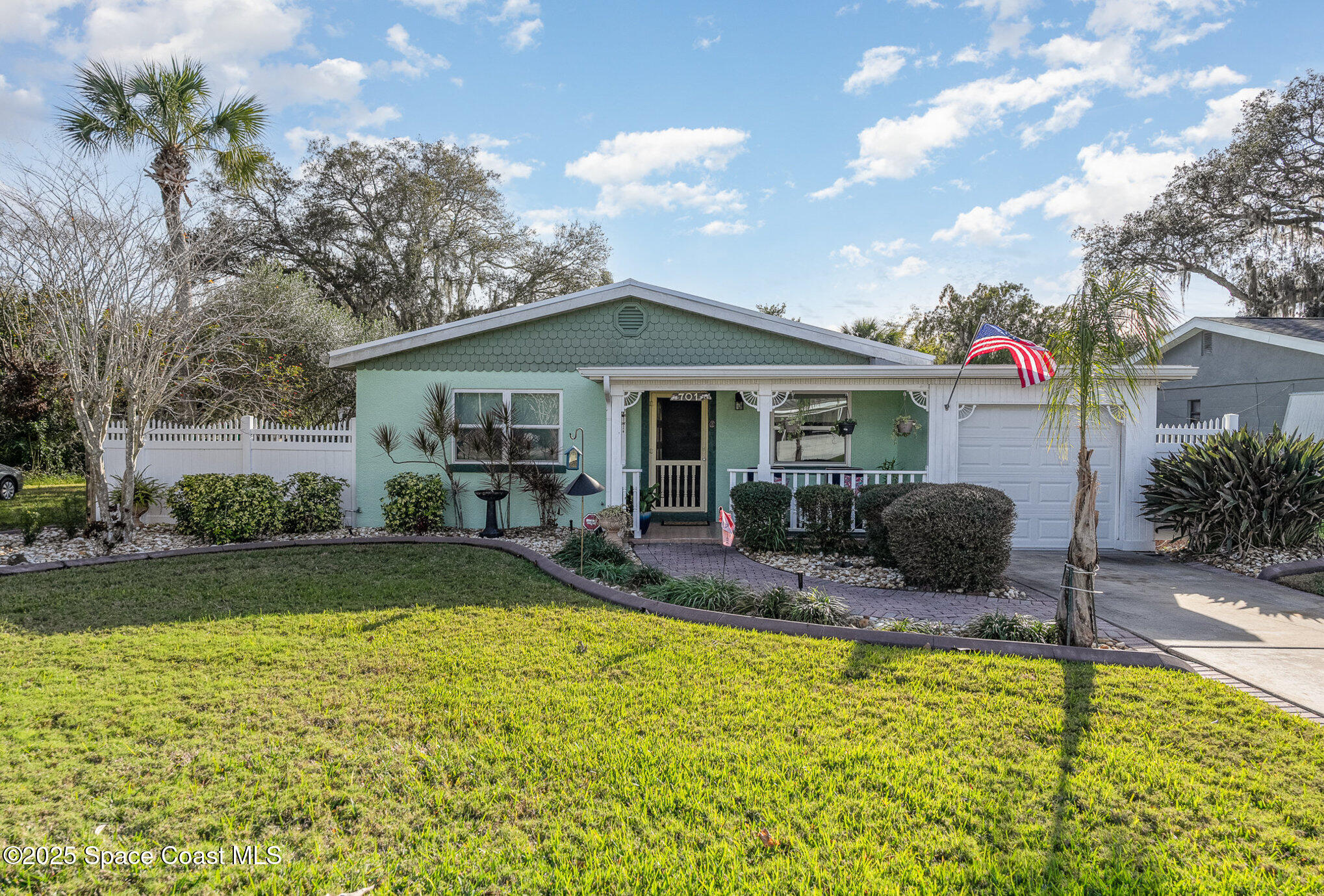 701 Espanola Way Melbourne, FL 32901 - Photo 2 of 29 a view of house with swimming pool outdoor seating