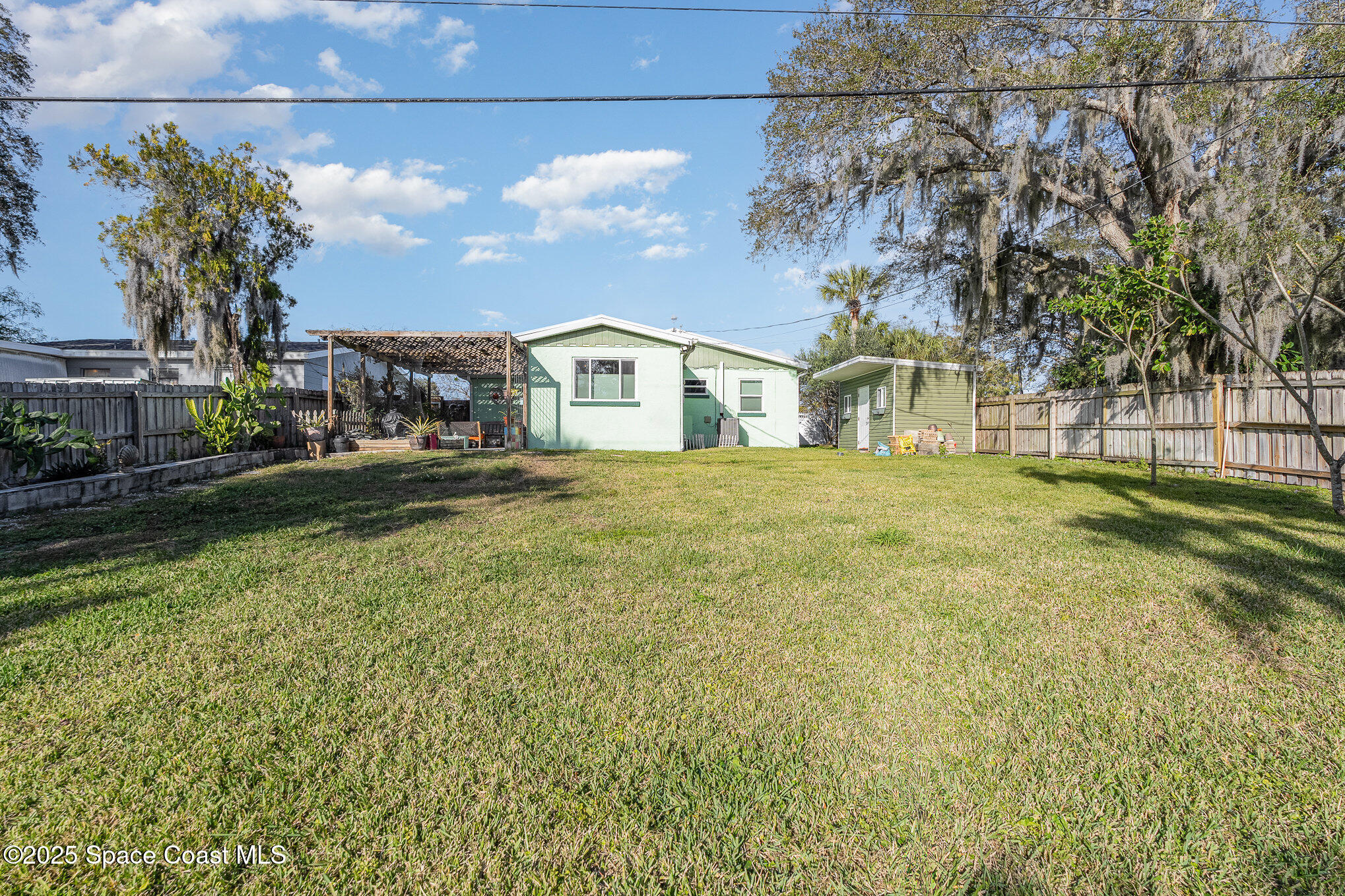 701 Espanola Way Melbourne, FL 32901 - Photo 24 of 29 a view of a house with a yard