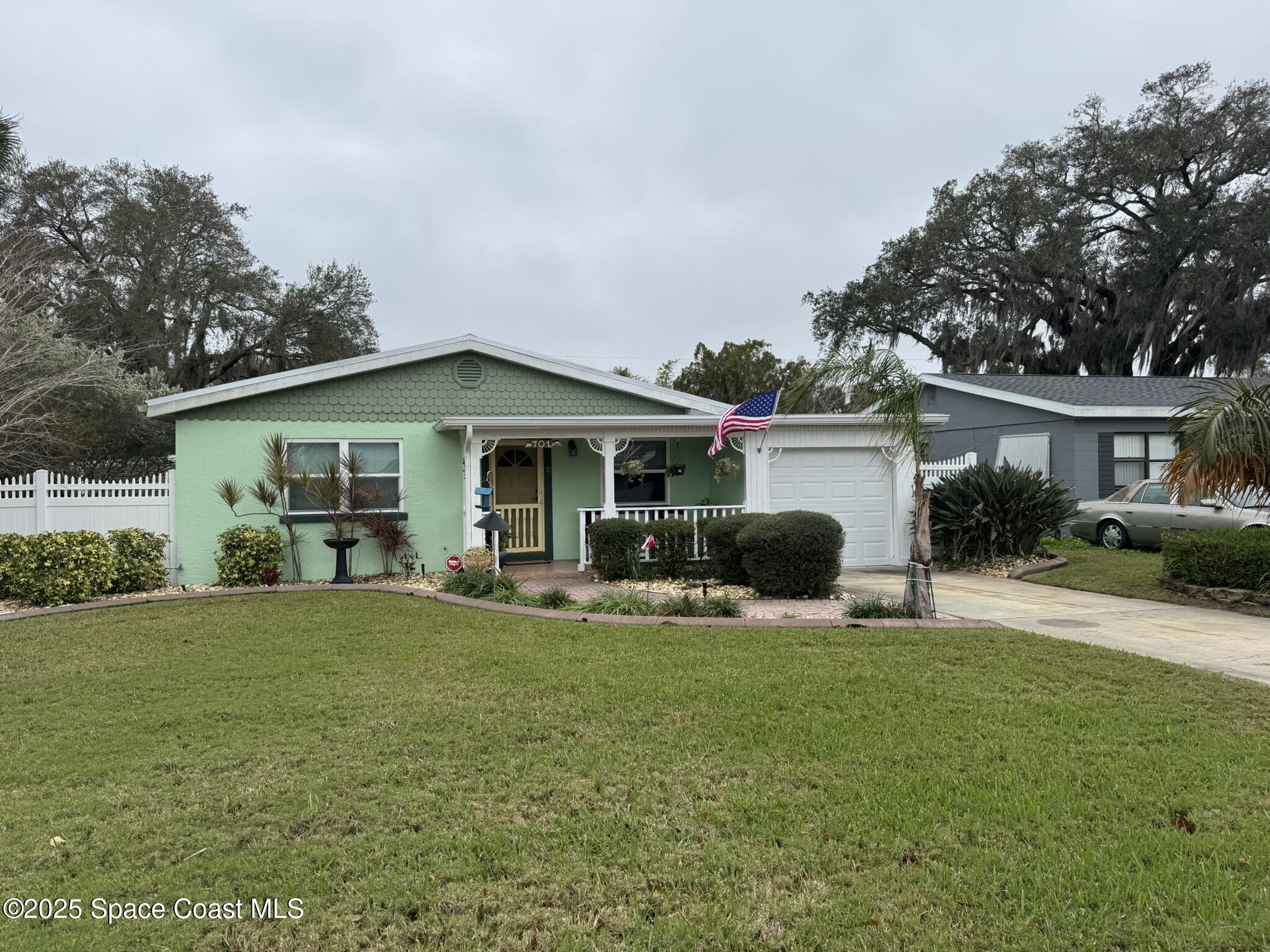 701 Espanola Way Melbourne, FL 32901 - Photo 26 of 29 a view of a house with a yard and sitting area