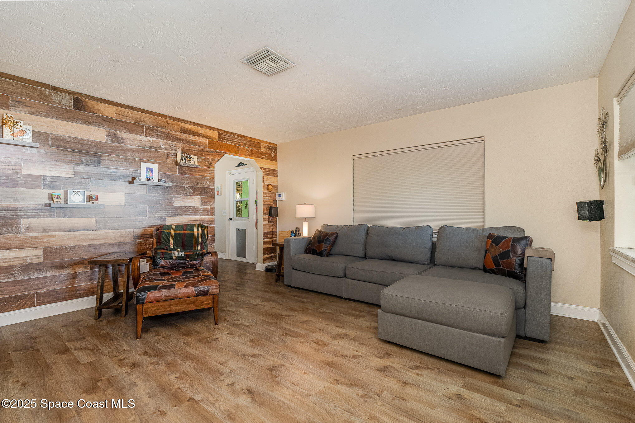 701 Espanola Way Melbourne, FL 32901 - Photo 9 of 29 a living room with furniture and a large window