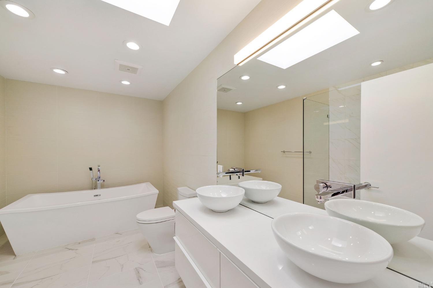 102 Red Hill Circle Tiburon, CA 94920 - Photo 12 of 20 a bathroom with a double vanity sink and a mirror