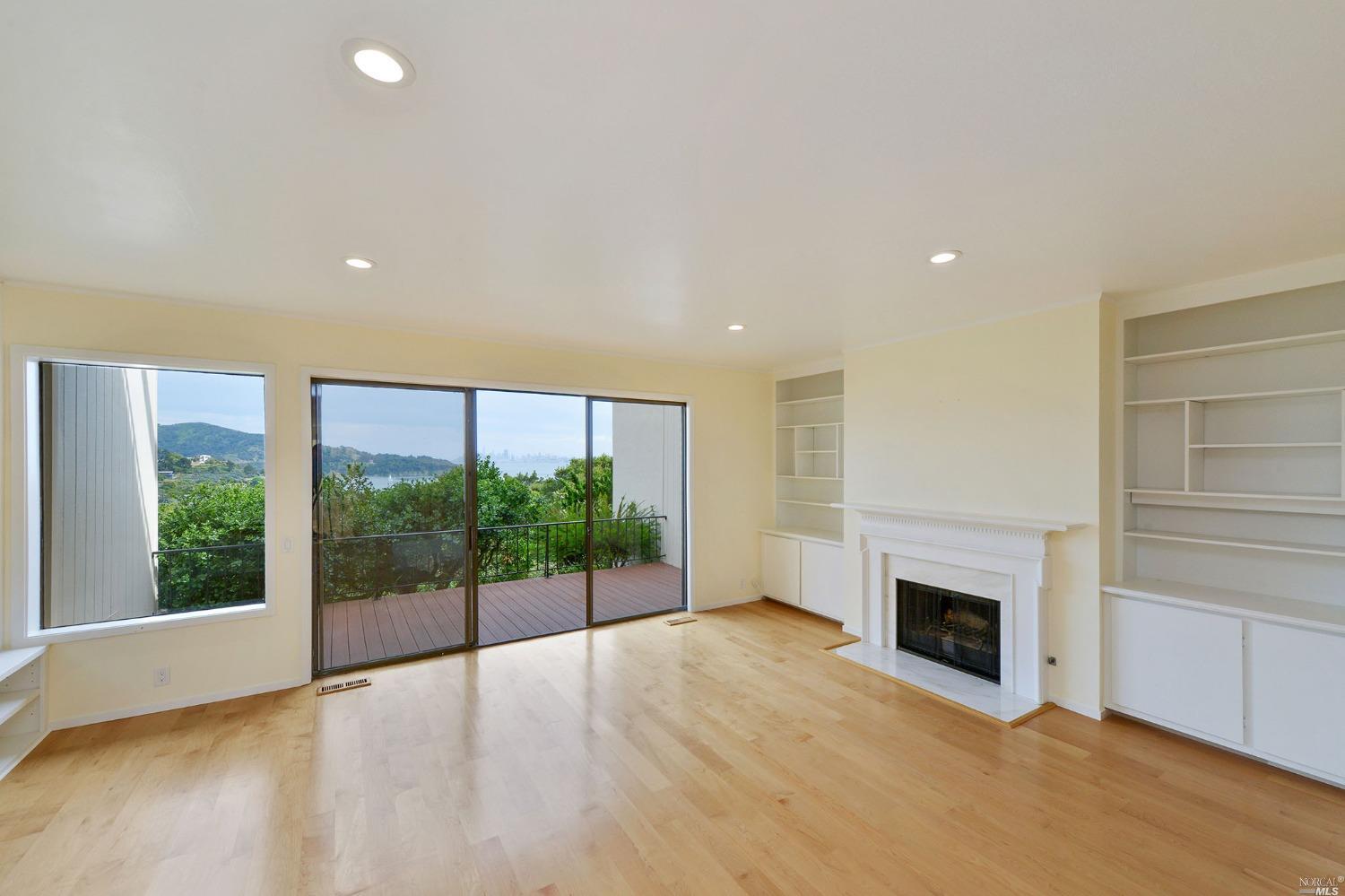 102 Red Hill Circle Tiburon, CA 94920 - Photo 2 of 20 a view of empty room with floor to ceiling window and fireplace