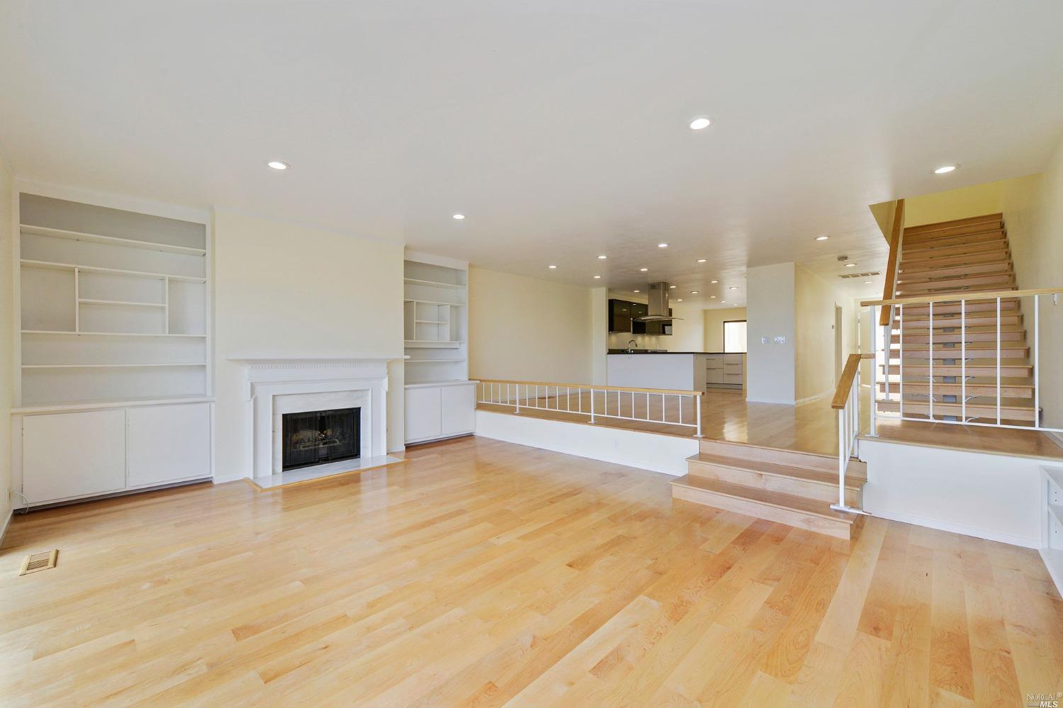 102 Red Hill Circle Tiburon, CA 94920 - Photo 4 of 20 a view of an empty room with a fireplace and a window