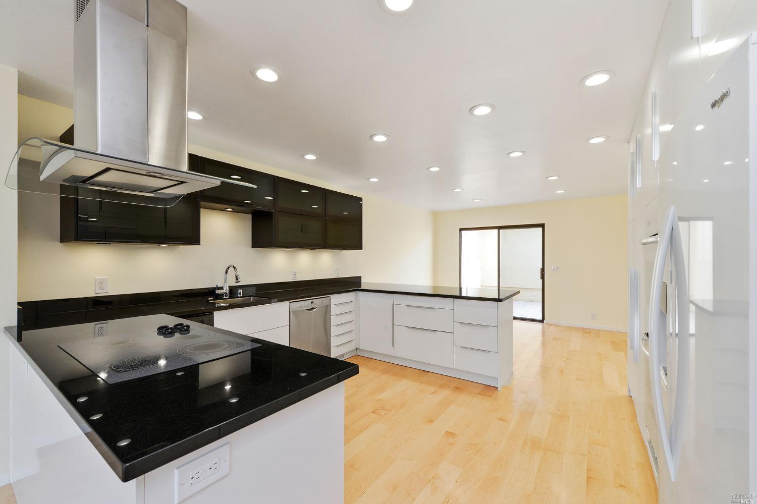 102 Red Hill Circle Tiburon, CA 94920 - Photo 8 of 20 a kitchen with stainless steel appliances granite countertop a sink and a stove top oven