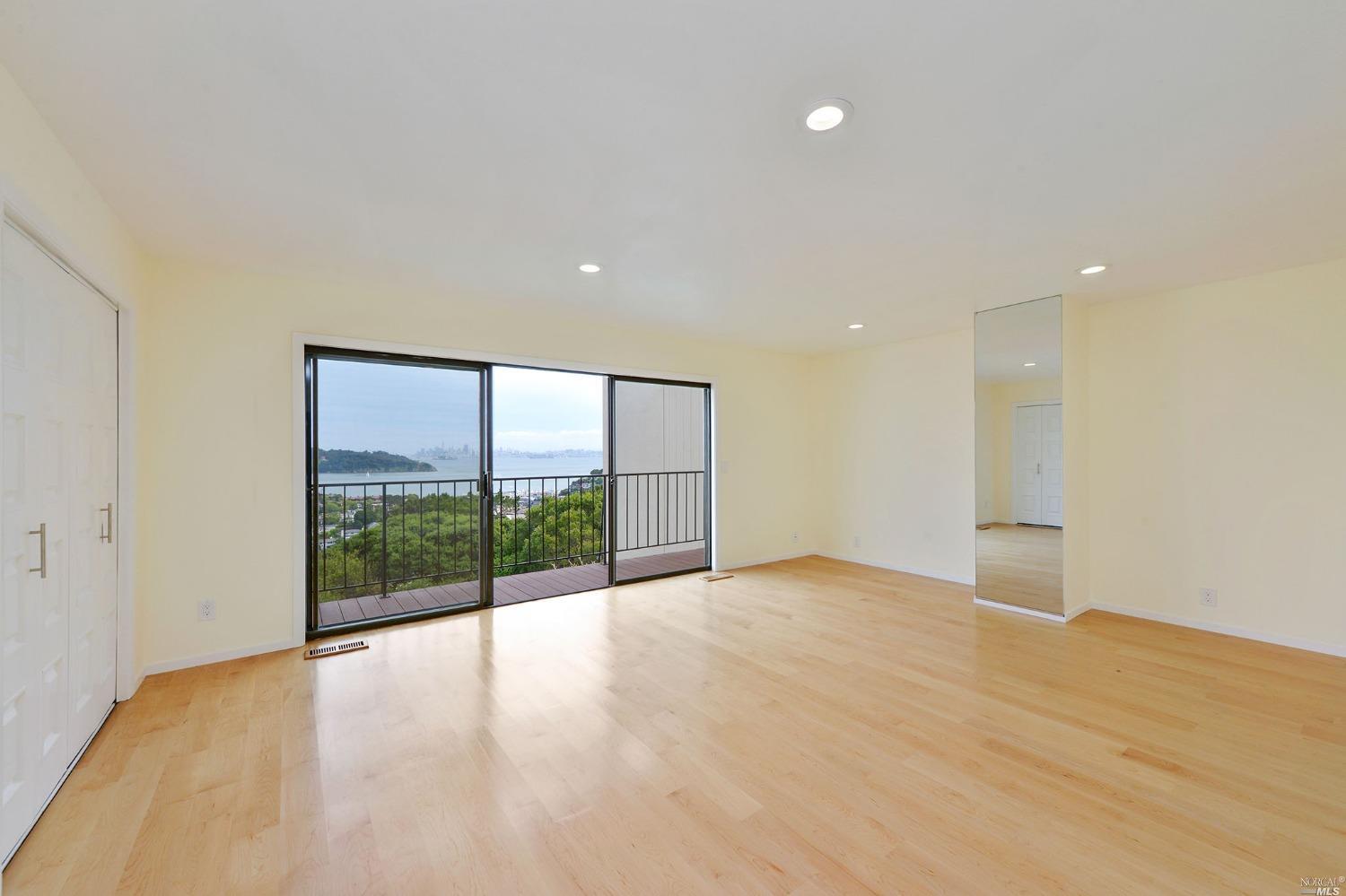 102 Red Hill Circle Tiburon, CA 94920 - Photo 10 of 20 a view of an empty room with wooden floor and a window