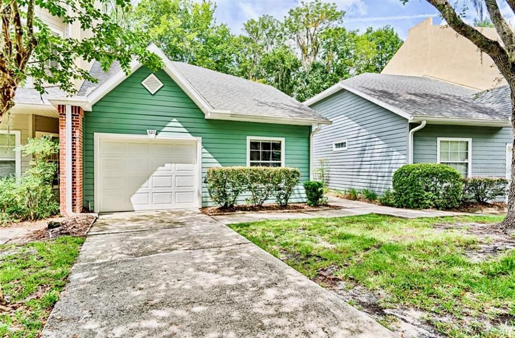 322 Northwest 50th Boulevard Gainesville, FL 32607 - Photo 1 of 19 a view of a house with yard and plants