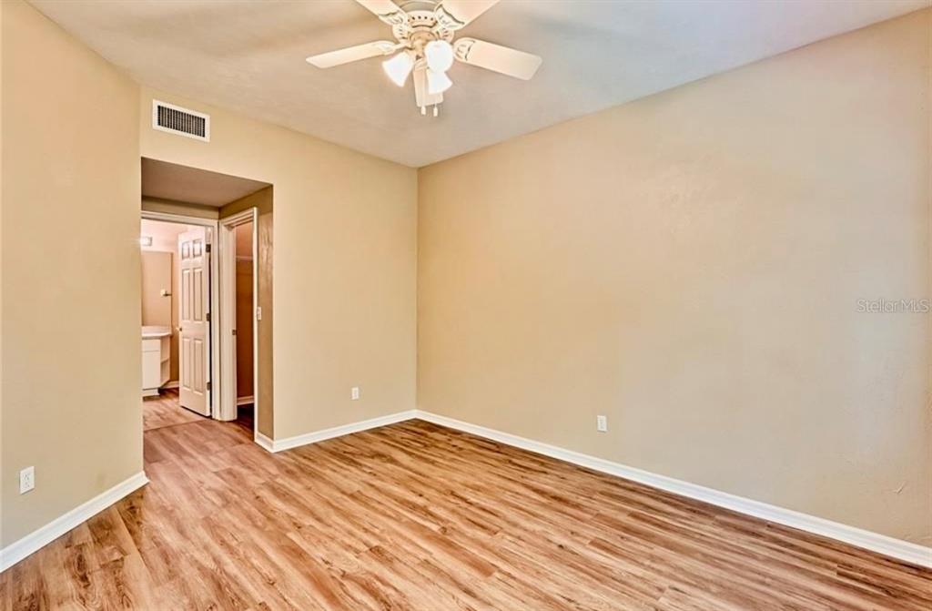 322 Northwest 50th Boulevard Gainesville, FL 32607 - Photo 14 of 19 wooden floor in an empty room with a window