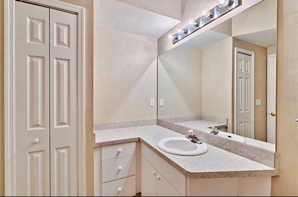 322 Northwest 50th Boulevard Gainesville, FL 32607 - Photo 17 of 19 a bathroom with a sink and a mirror