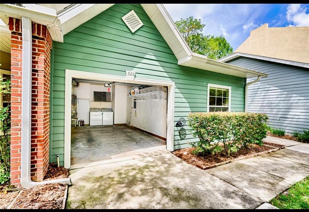 322 Northwest 50th Boulevard Gainesville, FL 32607 - Photo 18 of 19 a view of a backyard with plants