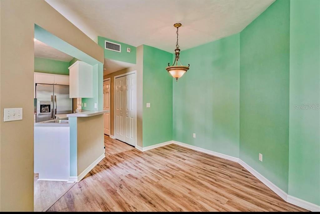 322 Northwest 50th Boulevard Gainesville, FL 32607 - Photo 5 of 19 a bedroom with a bed and a chandelier