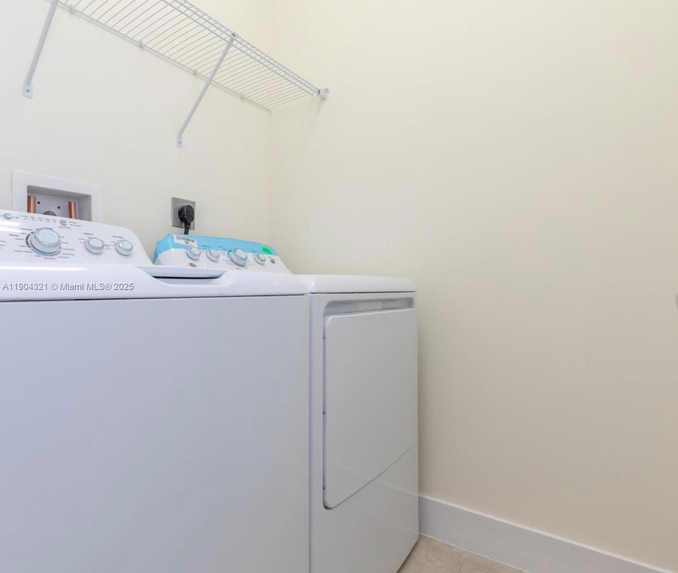 15861 Northwest 90th Court, Unit 15861 Miami Lakes, FL 33018 - Photo 15 of 31 a bathroom with a sink and vanity