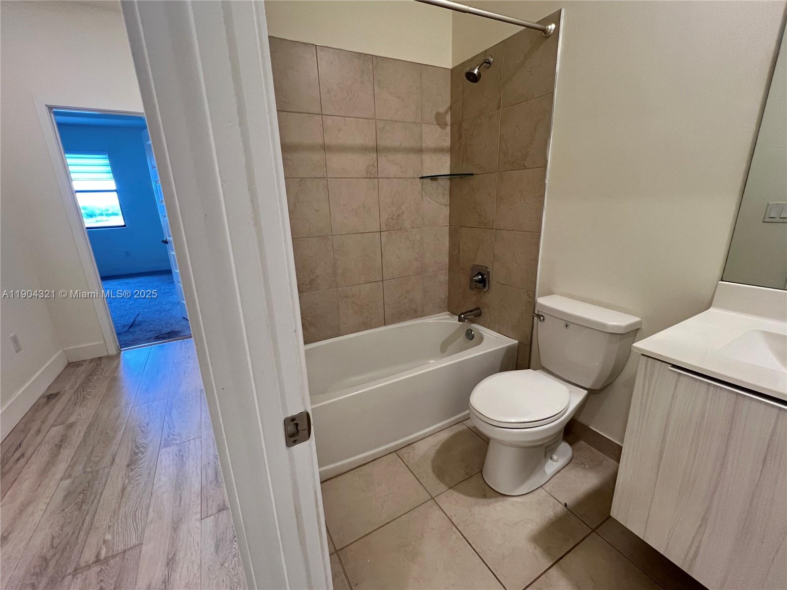 15861 Northwest 90th Court, Unit 15861 Miami Lakes, FL 33018 - Photo 9 of 31 a bathroom with a toilet and a shower