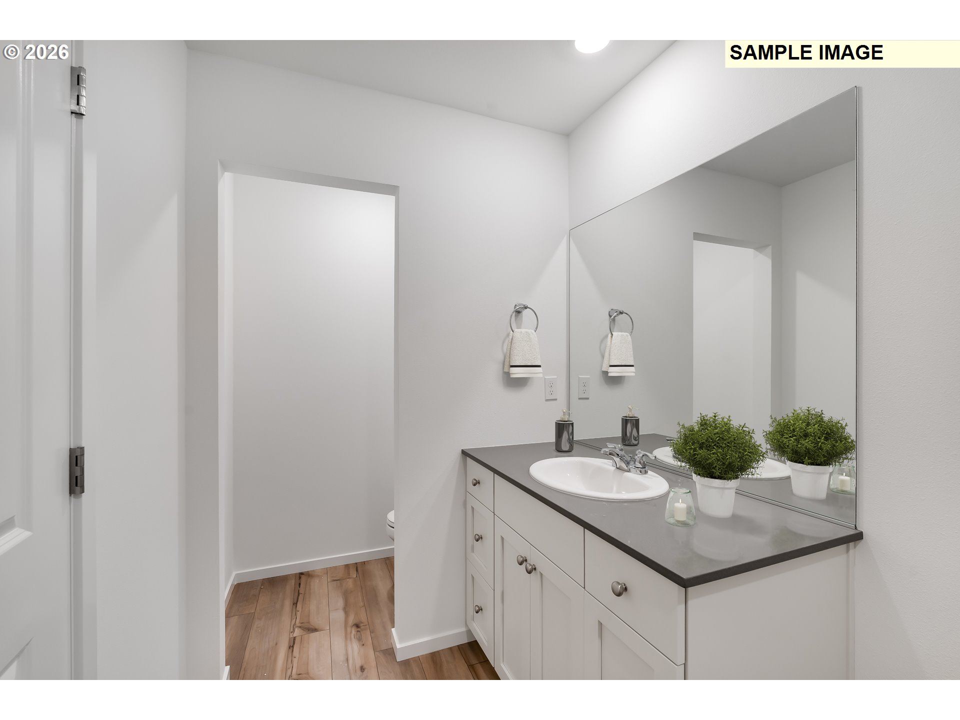 25229 Tanglewood Way Veneta, OR 97487 - Photo 15 of 16 a bathroom with a granite countertop sink and a mirror