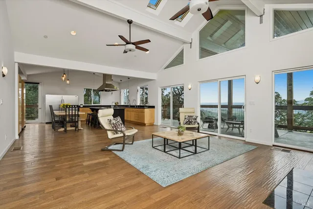 a kitchen with stainless steel appliances granite countertop a sink a stove and a refrigerator