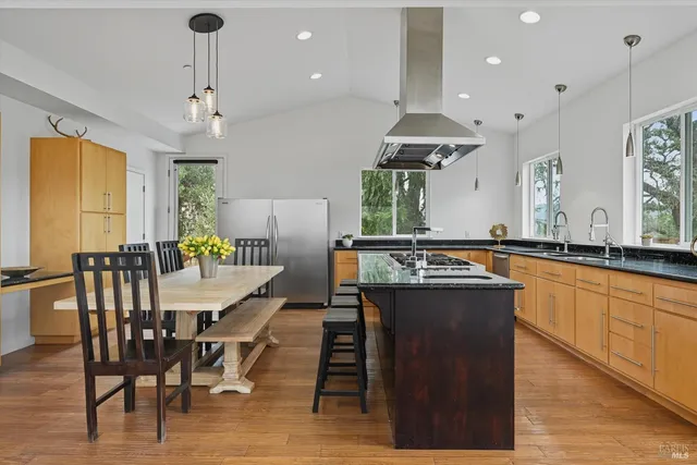 a living room with furniture and a painting on the wall