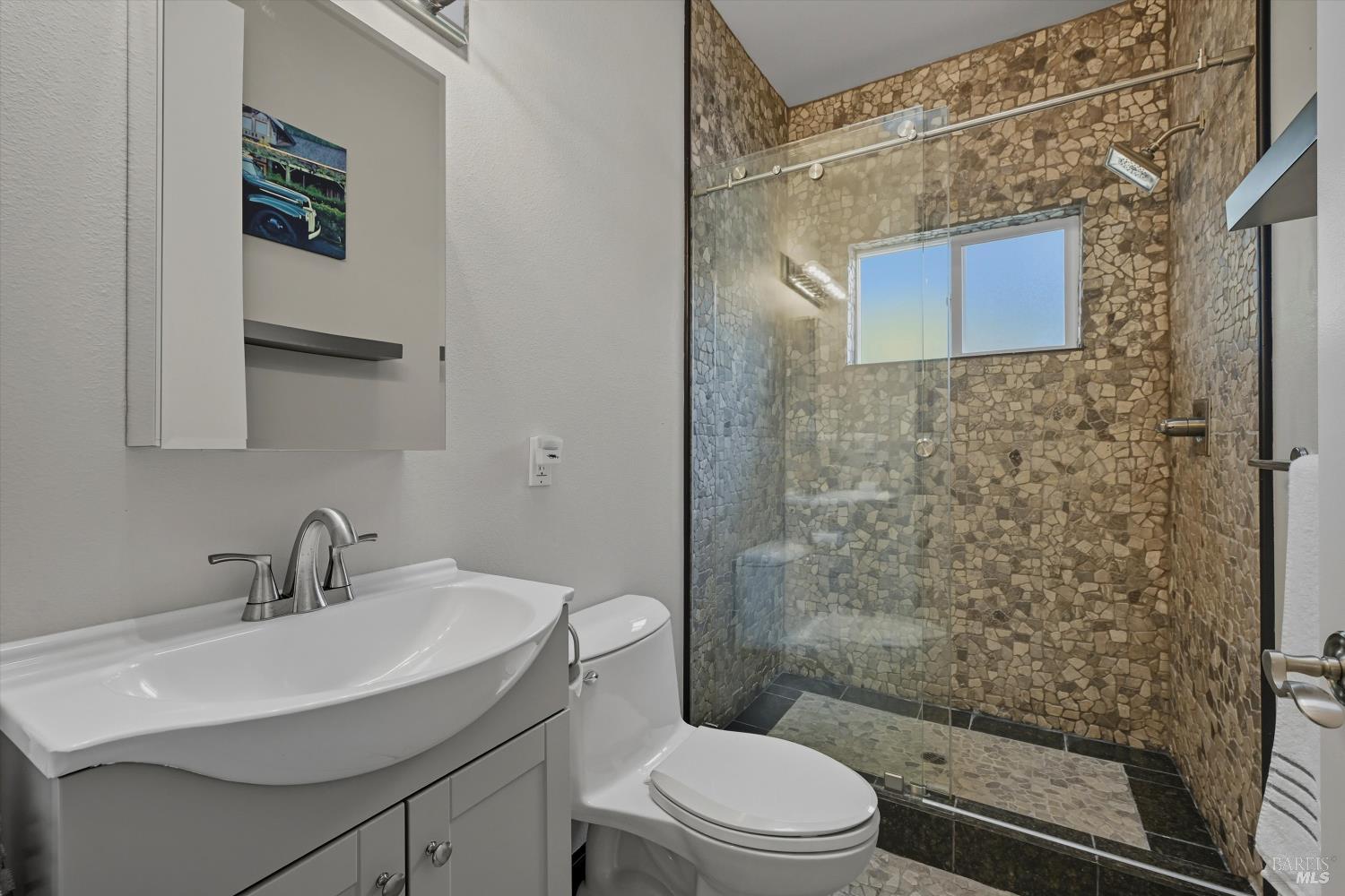 31000 Pine Mountain Road Cloverdale, CA 95425 - Photo 25 of 64 Primary ensuite bathroom with a separate toilet room and cobblestone shower.