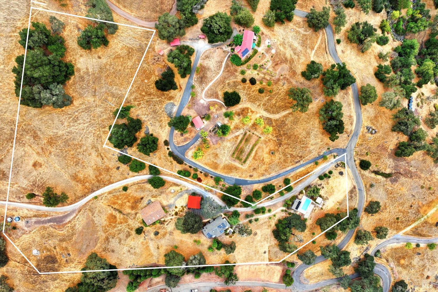 31000 Pine Mountain Road Cloverdale, CA 95425 - Photo 42 of 64 A color aerial view outlining the property boundaries and showing the relationship between the residence, pool area, and surrounding land.