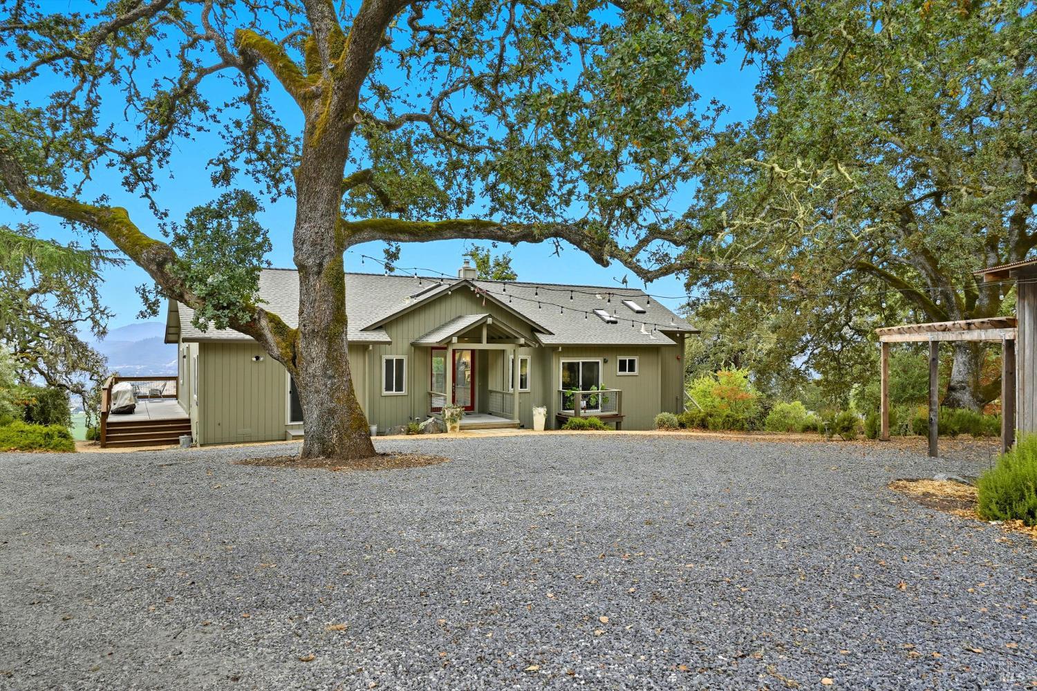 31000 Pine Mountain Road Cloverdale, CA 95425 - Photo 5 of 64 A spacious courtyard beneath mature oaks, ideal for gatherings, parking, and everyday ease.