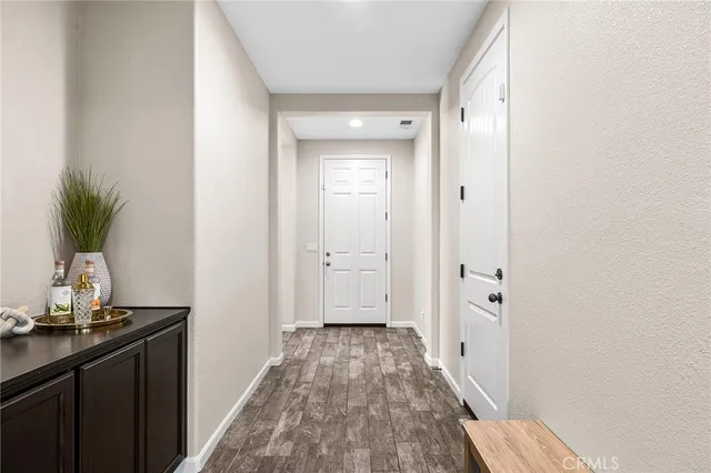 a view of a room with wooden floor