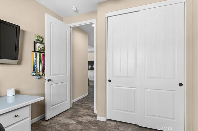 a view of a storage and utility room with closet area