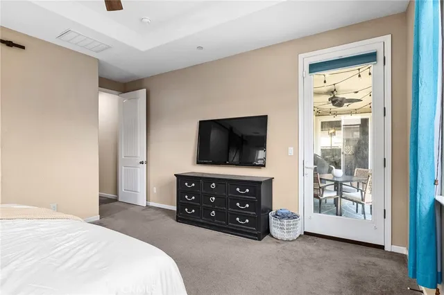 a bedroom with a bed and a television