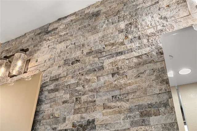 a bathroom with a toilet and a shower curtain