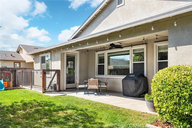 a view of a chairs in backyard of the house
