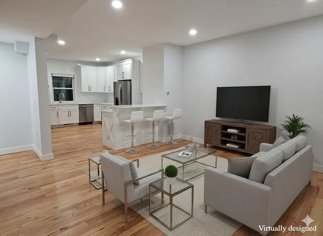 a living room with furniture and a flat screen tv