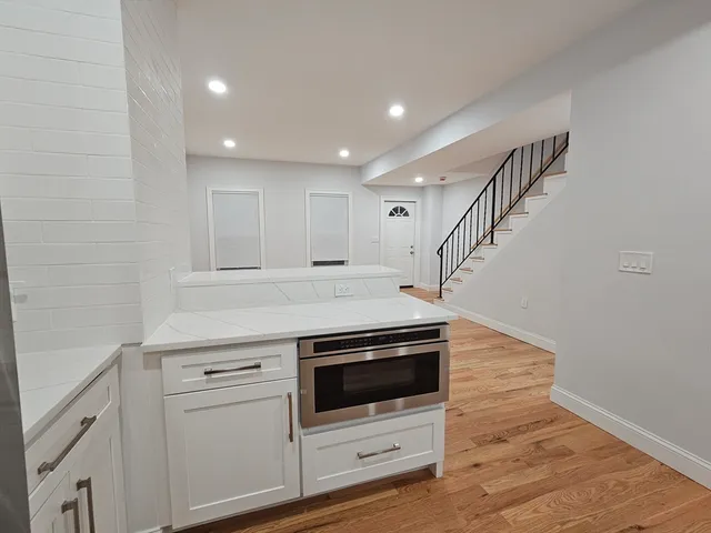 a view of a kitchen with washer and dryer