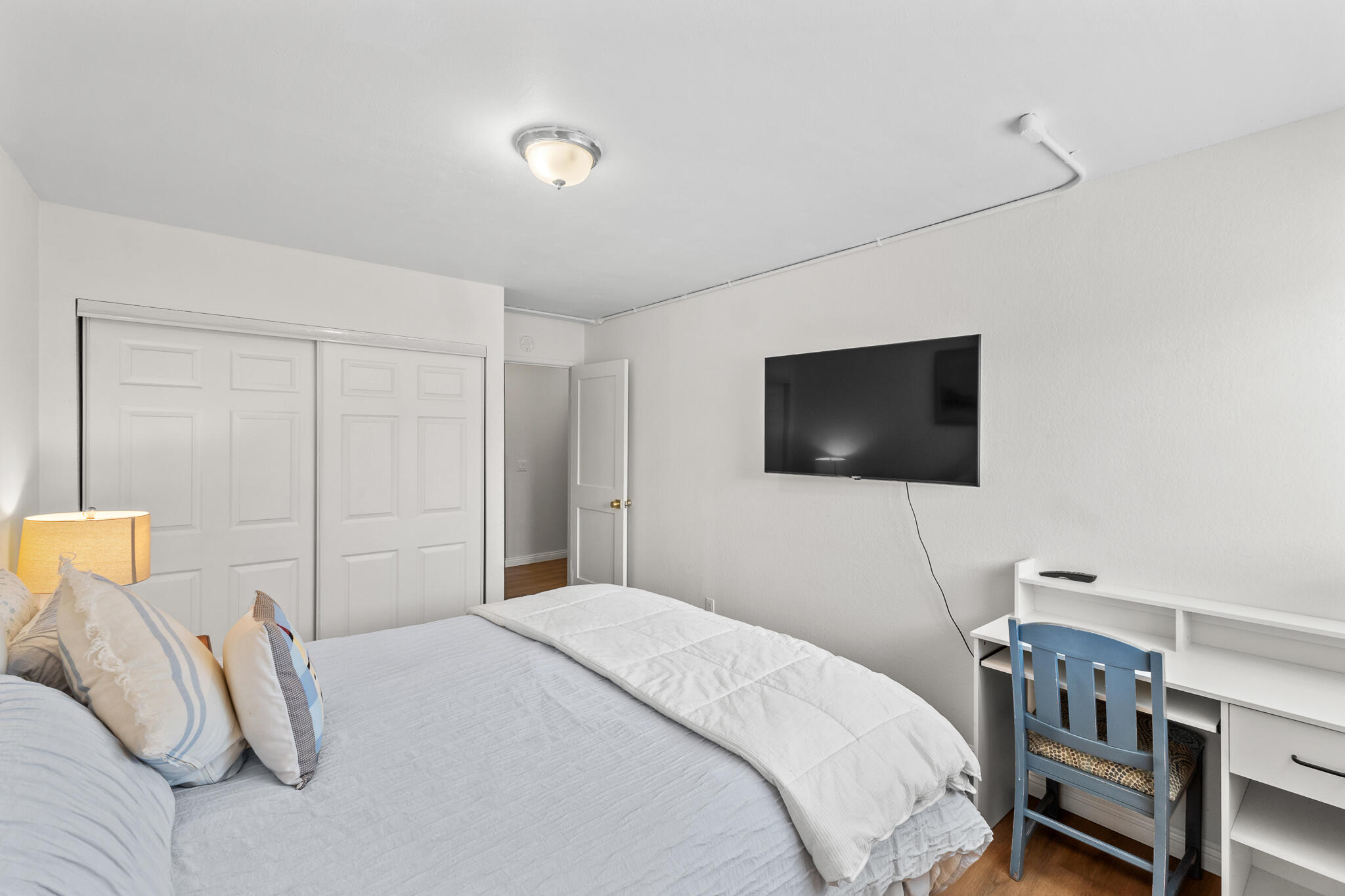 77 North Ocean Avenue, Unit 12 Cayucos, CA 93430 - Photo 26 of 41 a bedroom with a bed and a flat screen tv