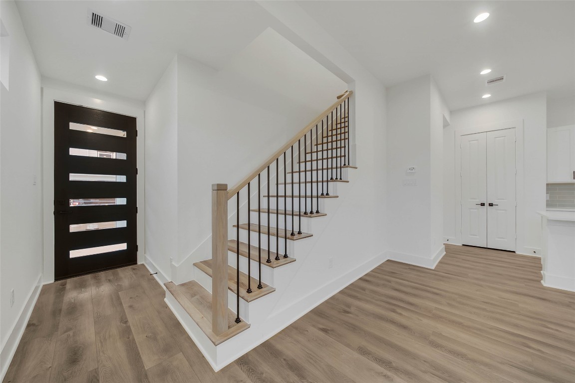 7709 Inwood Grove Lane Houston, TX 77088 - Photo 13 of 36 a view of entryway with wooden floor