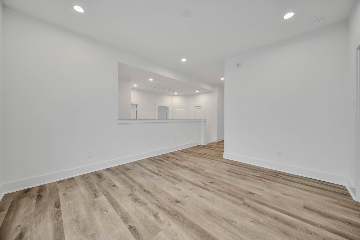7709 Inwood Grove Lane Houston, TX 77088 - Photo 15 of 36 an empty room with wooden floor and windows