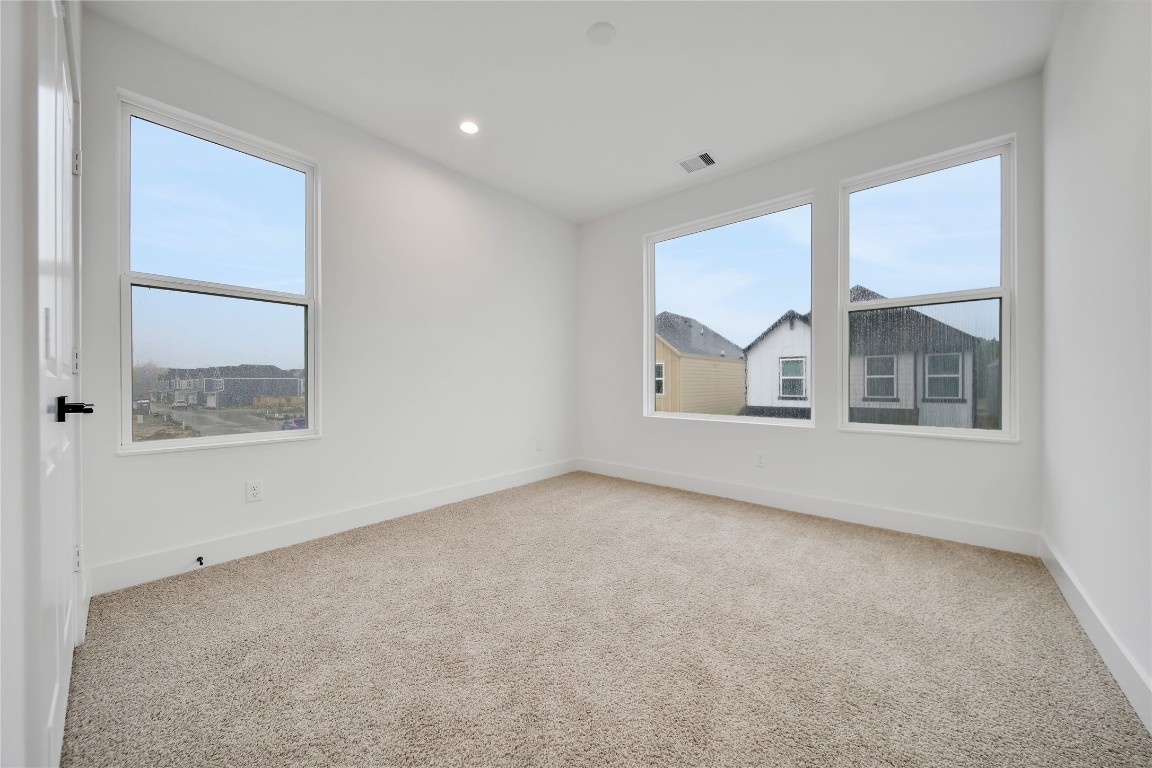 7709 Inwood Grove Lane Houston, TX 77088 - Photo 22 of 36 an empty room with a window