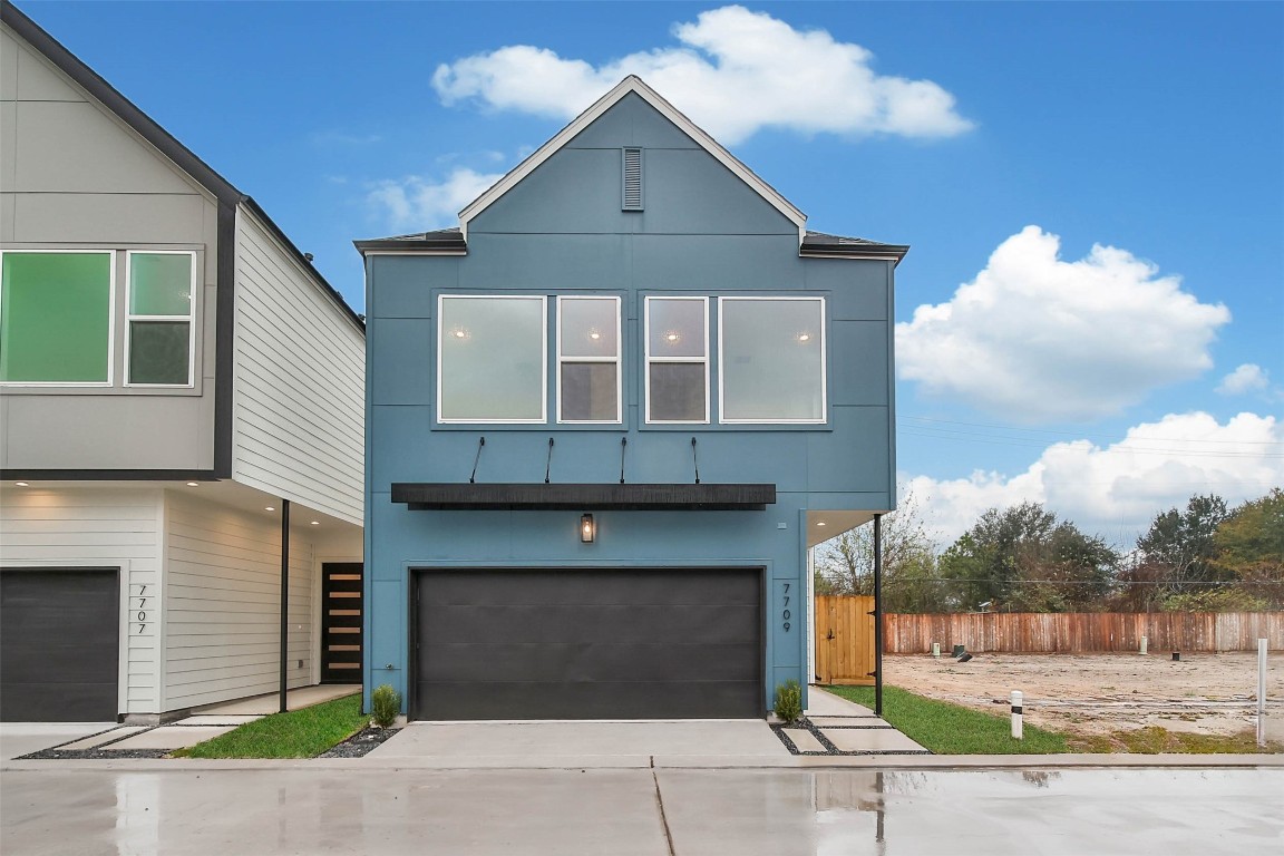 7709 Inwood Grove Lane Houston, TX 77088 - Photo 29 of 36 a front view of a house with a garage