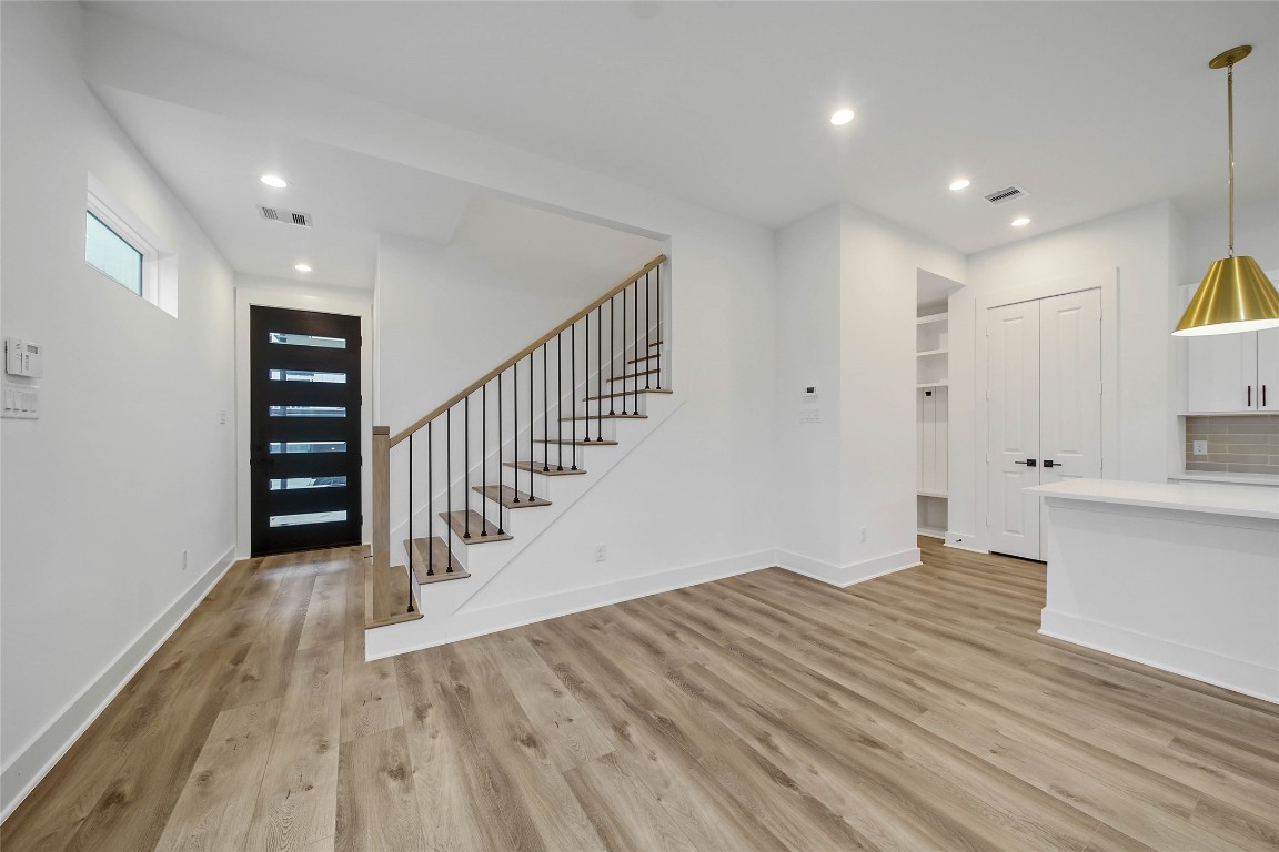 7709 Inwood Grove Lane Houston, TX 77088 - Photo 3 of 36 a view of hallway with wooden floor
