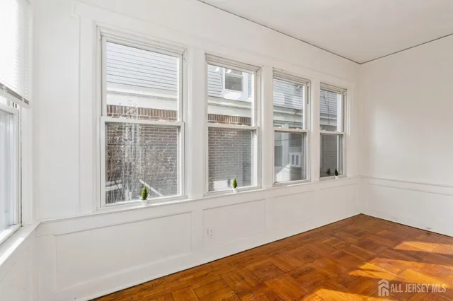 a view of a bedroom with a large window