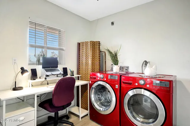 a view of livingroom with washer and dryer