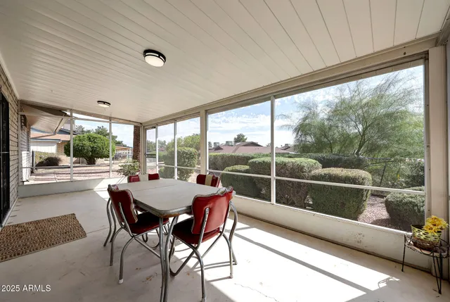 a view of a dining room with furniture window and outside view