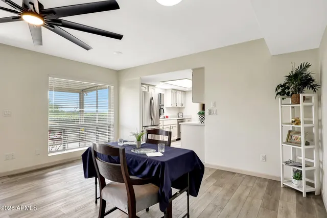 a view of a dining room with furniture window and wooden floor