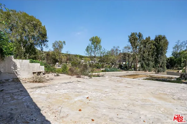 a view of a backyard of a house